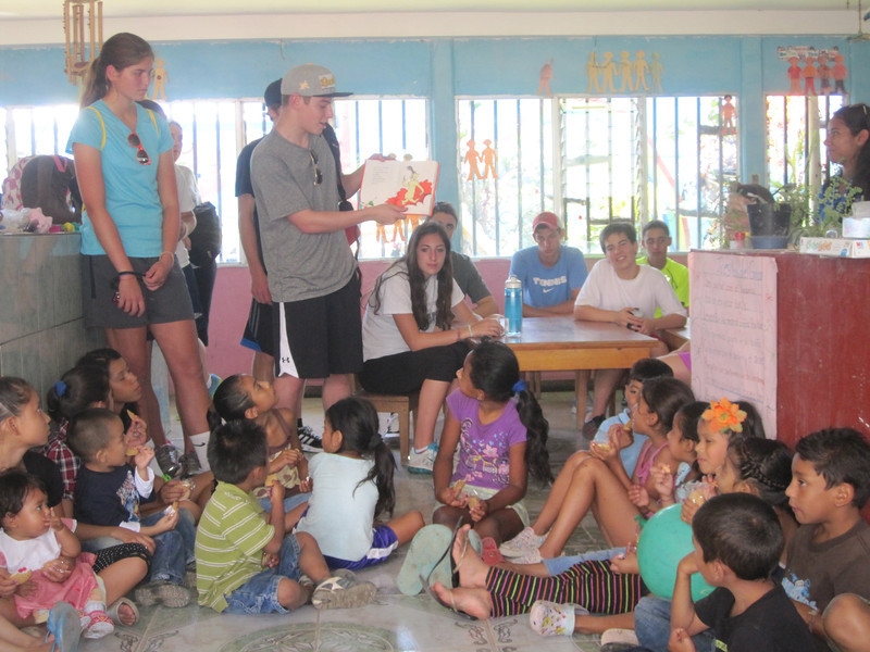 Costa Rica Community Service Holding Story Time for the School
