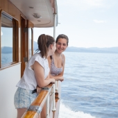Teens enjoying the beautiful sites of Lake Tahoe on a private boat