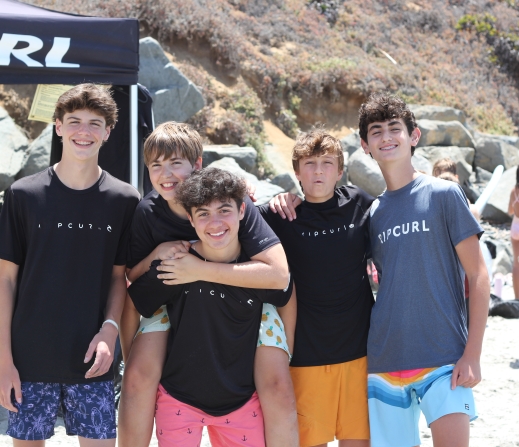Group of teens on a beach in San Diego while on a teen tour