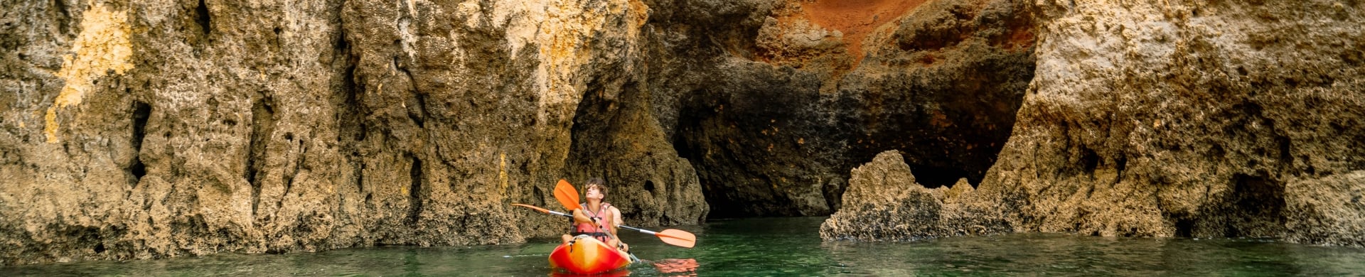 Teen kayaking on a trip to Portugal